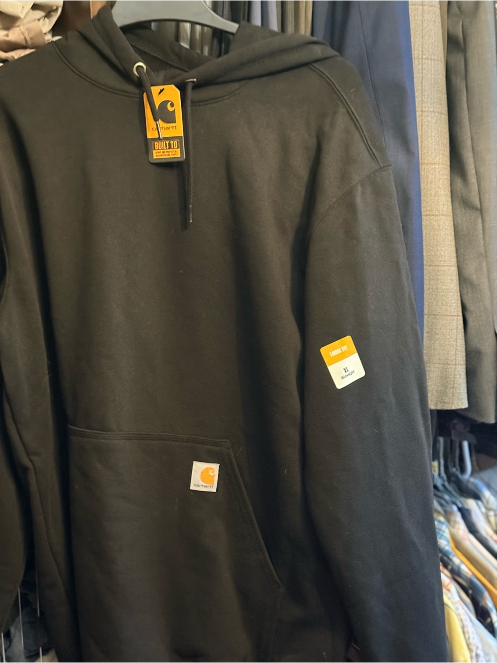 Classic black Carhartt loose fitting med weight hoodie. New with tags.